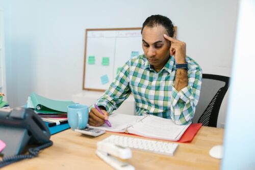 stressed man sitting at desk