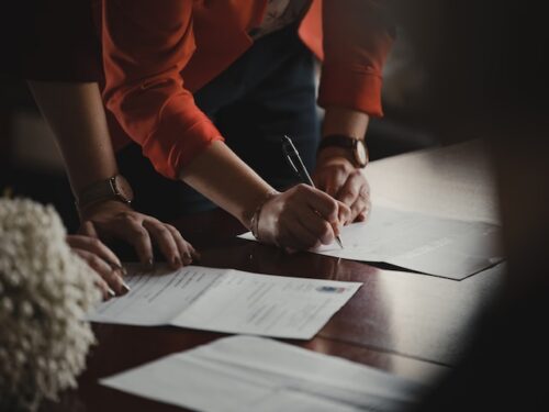 people completing documents